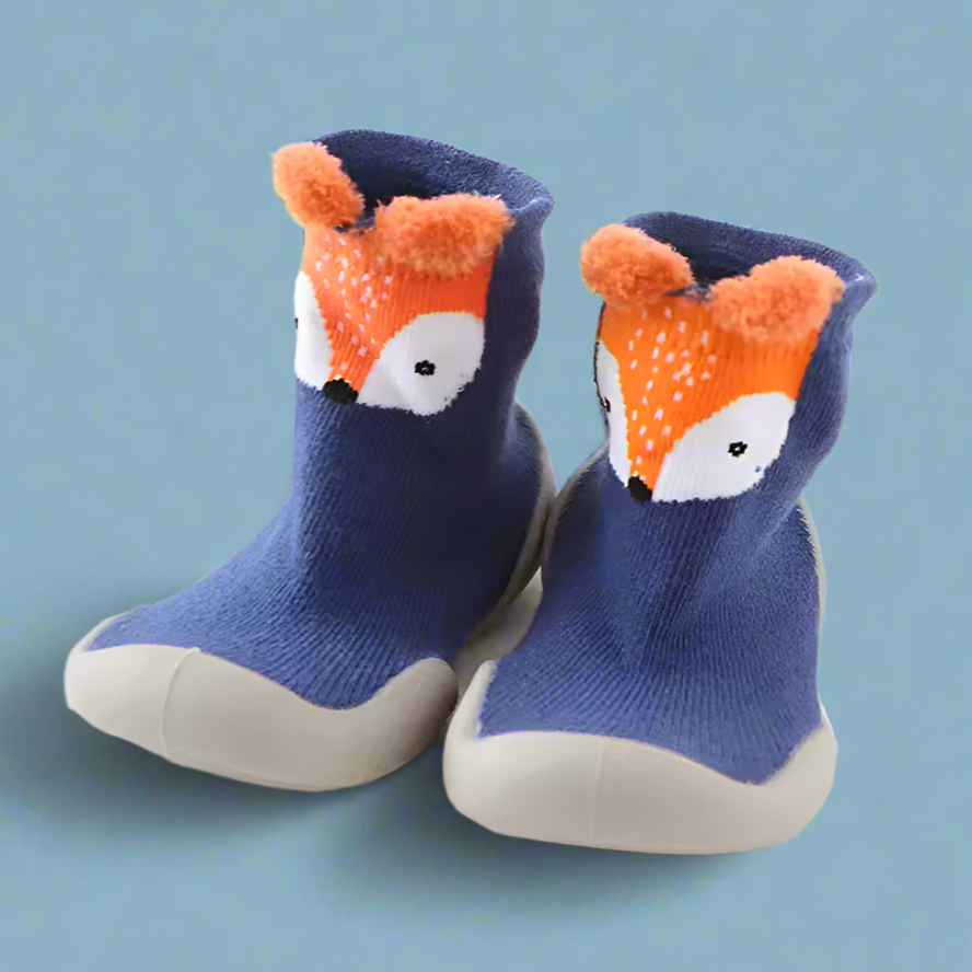 Pair of children's socks with fox design on a blue background