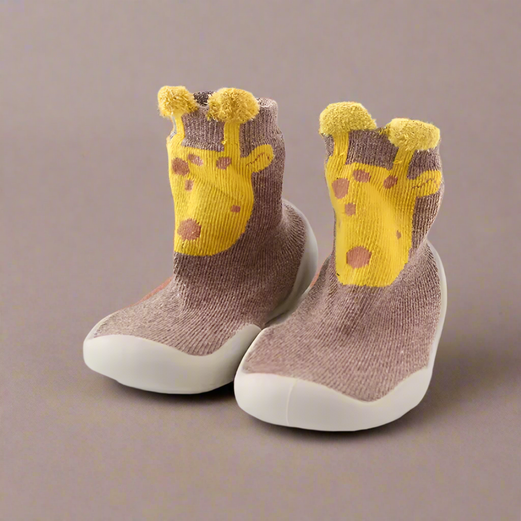 Pair of children's socks with giraffe design on a white background